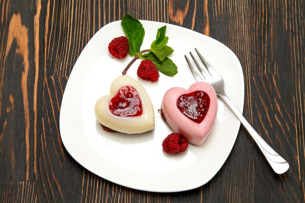 Panna cotta with raspberry jelly and fresh raspberries