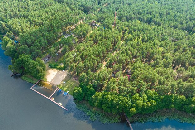 panorama aerial view over lake among forest