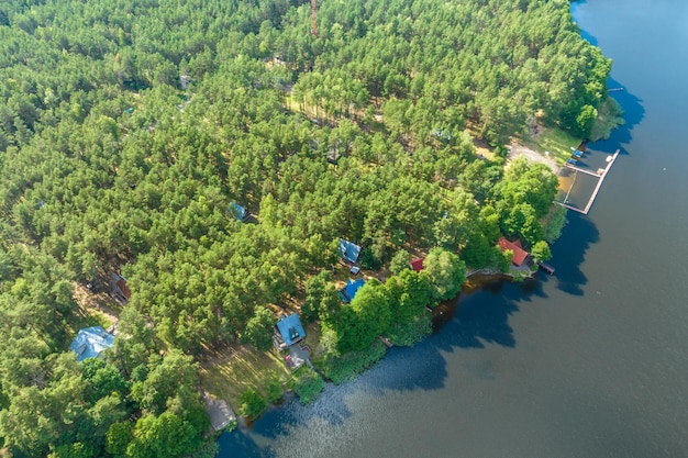 panorama aerial view over lake among forest