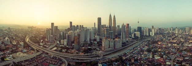 Panorama aerial view in the middle of Kuala Lumpur cityscape skyline early morning sunrise scene Malaysia