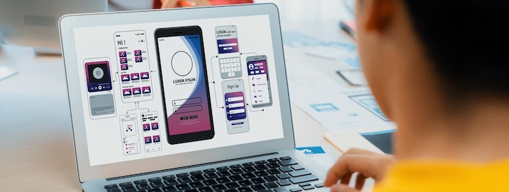 Photo panorama banner of startup ux developer or company employee design user interface or ui prototype for mobile application or website software with software display on laptop monitor in office synergic