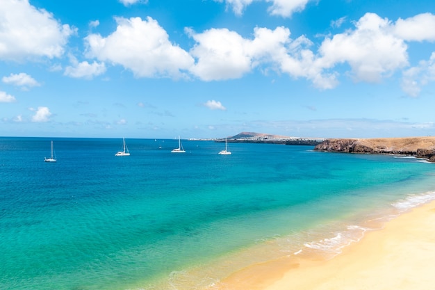 Panorama of beautiful beach and tropical sea of Lanzarote Canaries