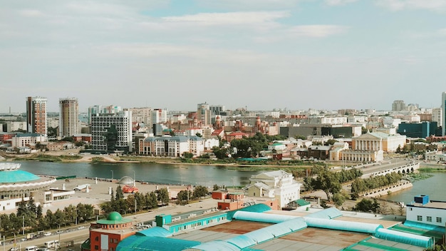 Panorama of a big city with many buildings and a river