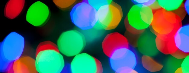 Panorama bokeh texture of multicolored christmas and new year lights