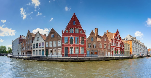 Panorama of bruges canal with beautiful medieval colored houses in the morning belgium