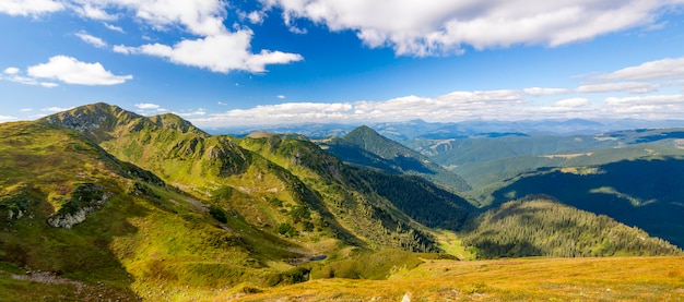 Panorama of Carpathian mountains in summer sunny day.