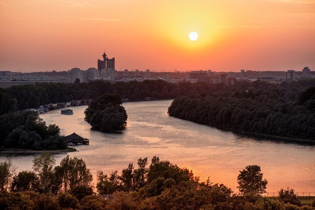 Panorama of the city of Belgrade, Danube river and Veliko ratno ostrvo (Great War Island) at sunset.