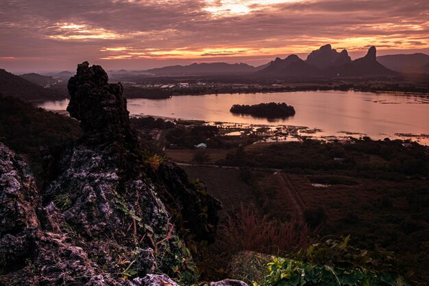 Panorama dramatic silhouettee mountain landscape at sunset in the sea