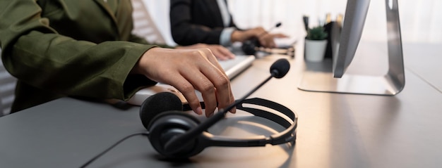 Panorama focus headset on call center workspace desk with blur operator Prodigy