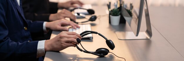 Panorama focus headset on call center workspace desk with blur operator Prodigy