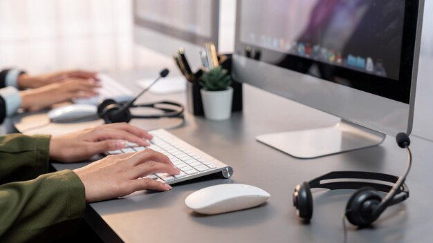 Panorama focus headset on call center workspace desk with blur operator Prodigy