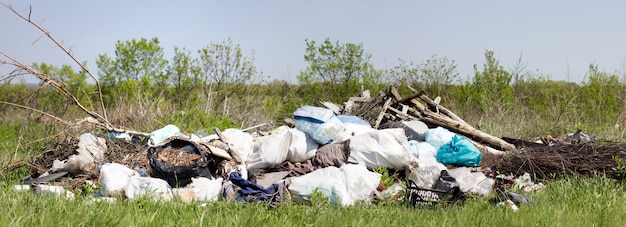 Panorama of a garbage dump in a field