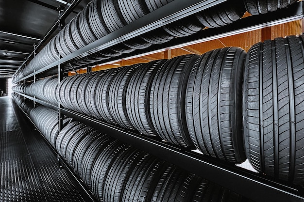 Photo panorama image of a new tire is placed on the tire storage rack in the tire industry