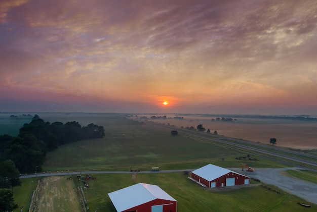 Panorama landscape view in sunrise over the meadow in the morning fog in the thick fog natural landscape