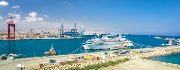 panorama of limassol sea port cyprus with docked ships and cargo terminal with portal cranes