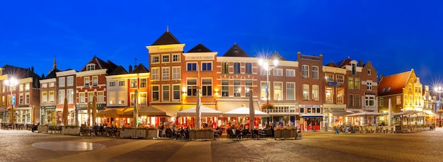 Panorama Markt square with typical Dutch houses in the center of the old city at night, Delft, Holland, Netherlands