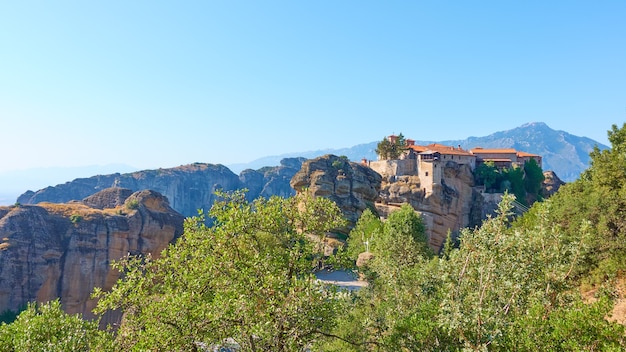 Panorama of Meteora with The Holy Monastery of Varlaam on the top of rock, Greece -  Greek panoramic landscape