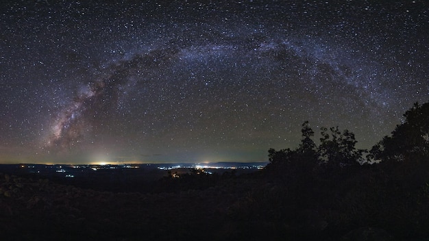 Panorama Milky way galaxy with knob stone ground is name Lan Hin Pum viewpoint at Phu Hin Rong Kla