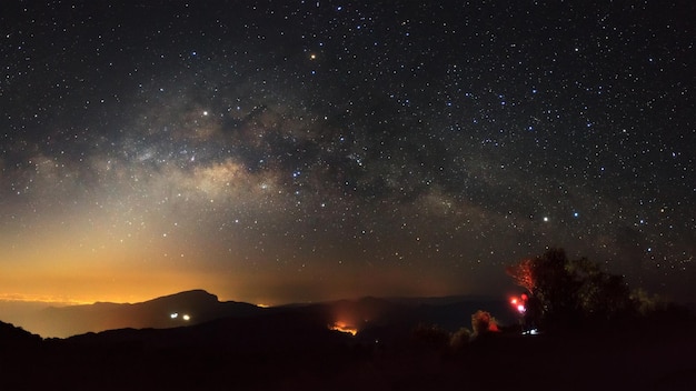 Panorama Milky Way Galaxy with light city at Doi inthanon Chiang mai Thailand