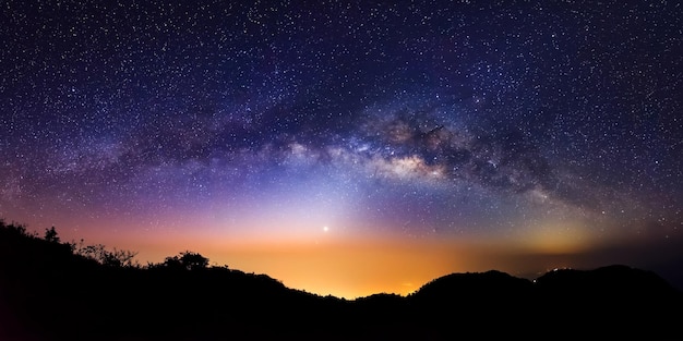 Panorama milky way galaxy and zodiacal light on moutain before sunrise