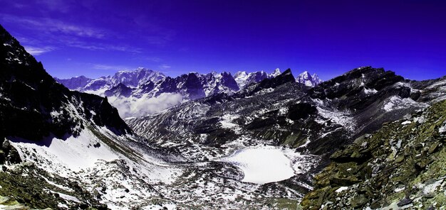 Panorama of mountains and snow in the himalayas trekking along everest circuit in nepal