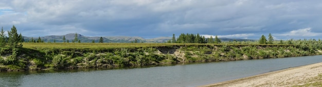 Panorama of the Northern river in the tundra