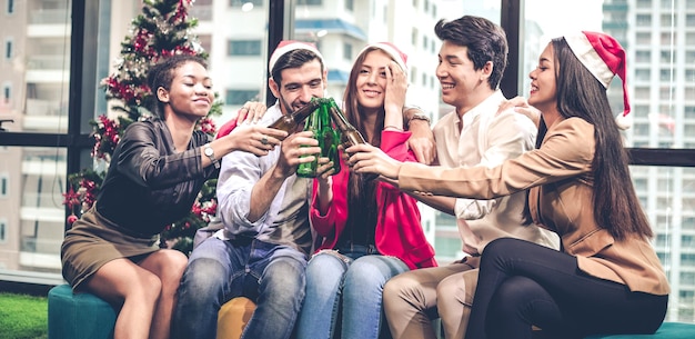 Panorama, party celebration Christmas and New Year of group office workers with drink and drunk beer with fun and smile in office. Celebration party concept.