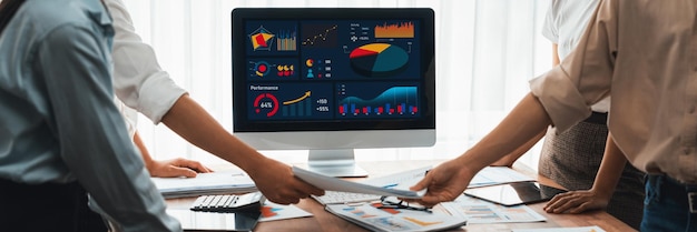 Photo panorama shot analyst team utilizing bi fintech to analyze financial report with laptop businesspeople analyzing bi power dashboard displayed on laptop screen for business insight scrutinize