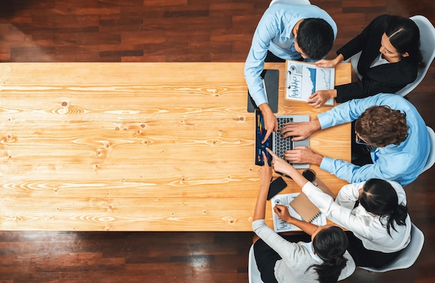 Panorama top view diverse analyst team analyzing financial data Meticulous