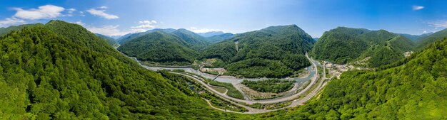 Panorama view cablestayed bridge on the adlerkrasnaya polyana motorway aerial view of car driving al