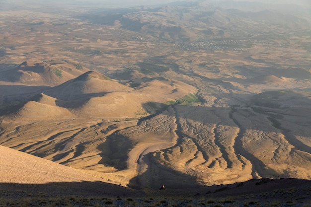 Panorama view from the Mount Ergies at the valley and the bed of dried up rivers during sunset Kayseri Turkey