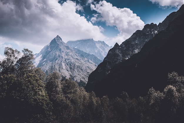 Panorama view on mountains scene in national park of Dombay, Caucasus, Russia. Summer landscape, sunshine weather and sunny day