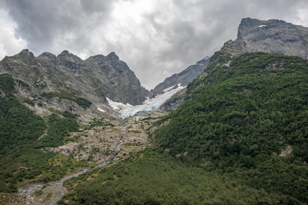 Panorama view on mountains scene in national park of Dombay, Caucasus, Russia. Summer landscape, sunshine weather and sunny day