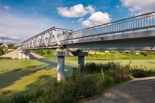 Panorama view near big huge bridge across river