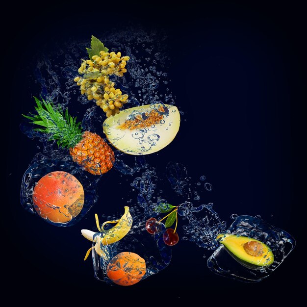 Photo panorama wallpaper with fruits in the water fresh pineapple grapes cherries avocados oranges are full of vitamins constituting the diet and human health