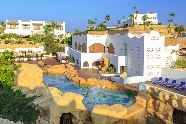 Panorama of white city at tropical luxury resort hotel egypt