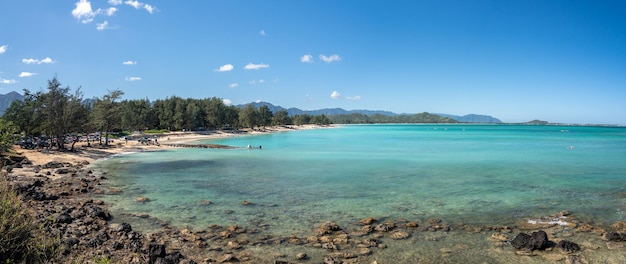 Panorama of the wide sandy Kailua Beach with mountains in background on east coast of Oahu in Hawaii