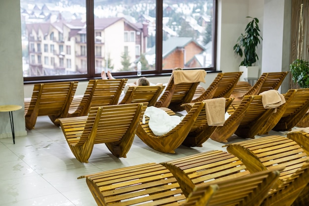 Panorama of wooden fancy loungers in resting space