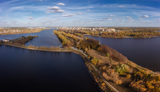 Panoramic aerial view of city on Volga with dam of water power house in foreground Dubna Russia