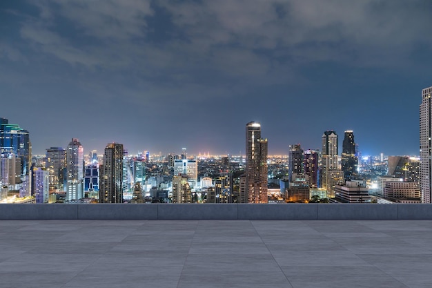 Panoramic Bangkok skyline view concrete observatory deck on rooftop night time Asian corporate and residential lifestyle Financial city downtown real estate Product display mockup empty roof
