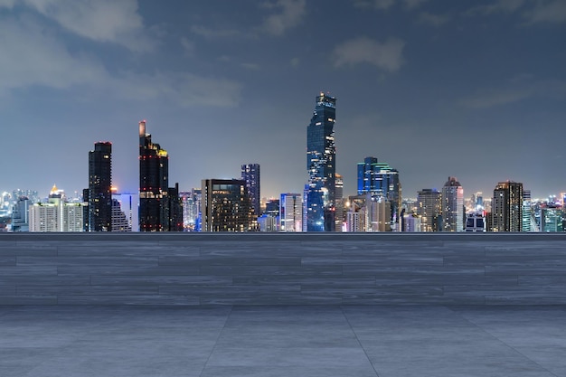 Panoramic Bangkok skyline view concrete observatory deck on rooftop night time Asian corporate and residential lifestyle Financial city downtown real estate Product display mockup empty roof