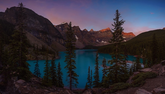 Panoramic of beautiful sunrise on the Moraine lake Canada