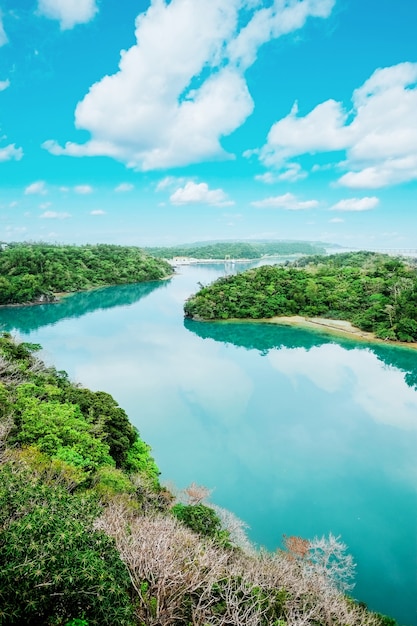 Panoramic bird eye aerial view of beautiful river mirror with fantasy blue sky in Okinawa, Japan