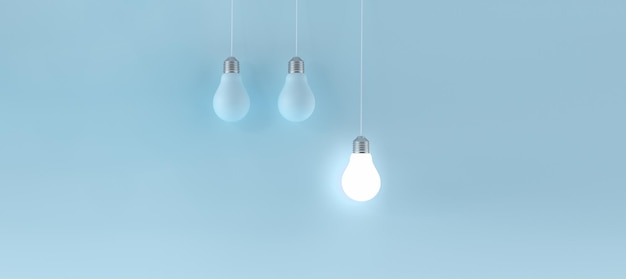 Panoramic blue background with Hanging illuminated light bulb Innovation concept