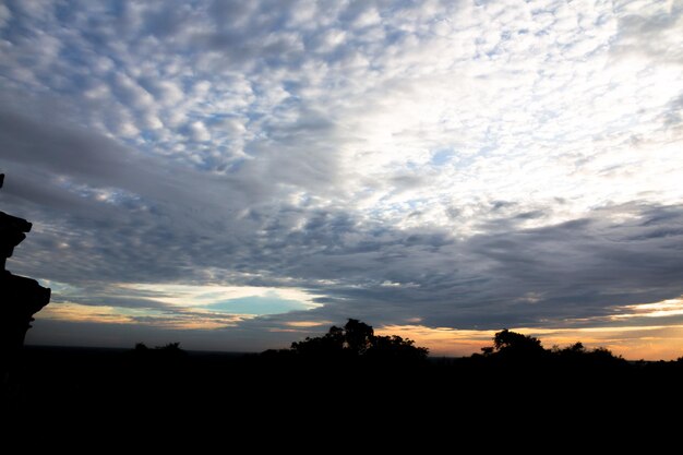 Panoramic cloudscape with the sun rays radiatingPhnom Bakheng sunset view Angkor WatCambodia