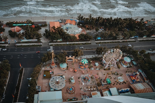 Panoramic coastal Vung Tau view from above with waves coastline streets coconut trees