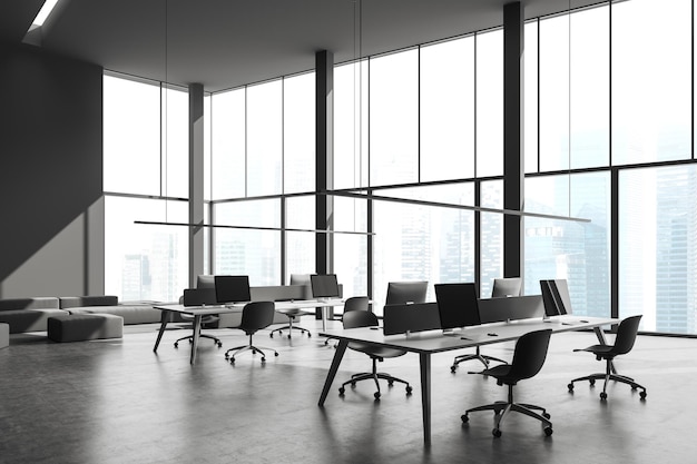 Панорамный серый офис открытого пространства с диваном