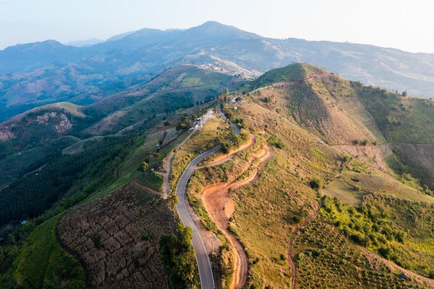 Panoramic landscape view long road and Mountain curved connecting countryside