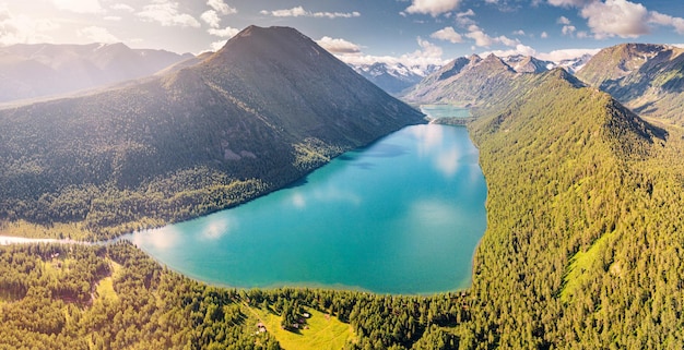 Panoramic morning view of famous natural attraction of Altai and Russia the Multa Lake at sunrise with majestic sky National park and outdoor recreation background