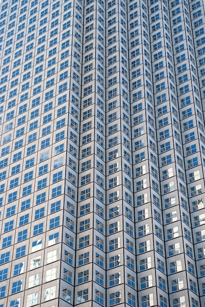 Panoramic and perspective wide angle view to steel blue background of glass high rise building skyscrapers in modern futuristic downtown at night Business concept of successful industrial architecture